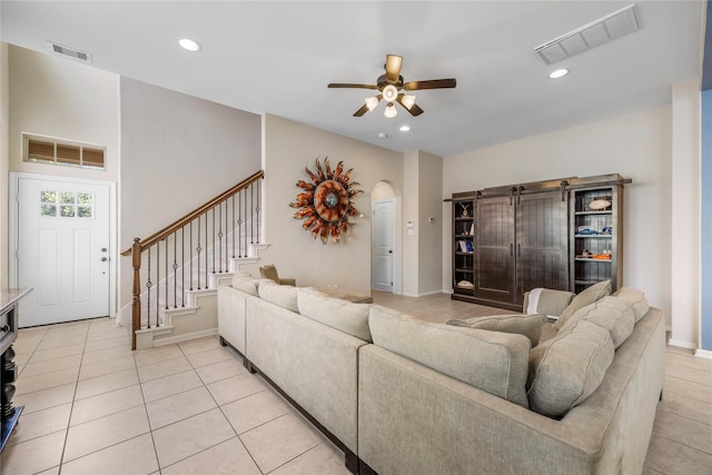 122 Cheswood Forest Dr, Montgomery, TX 77316 - living room featuring a ceiling fan, stairs, arched walkways, light tile patterned floors, and recessed lighting