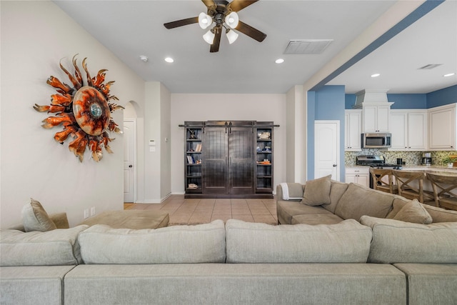 122 Cheswood Forest Dr, Montgomery, TX 77316 - living area with ceiling fan, arched walkways, recessed lighting, and light tile patterned floors