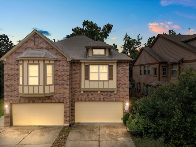 122 Cheswood Forest Dr, Montgomery, TX 77316 - view of front of property with brick siding, an attached garage, driveway, and roof with shingles