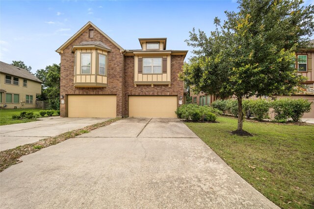 122 Cheswood Forest Dr, Montgomery, TX 77316 - view of front of house with brick siding, a front lawn, a garage, and driveway