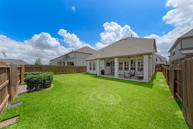 15610 Scolty Reach Ln, Humble, TX 77346 - rear view of house with a fenced backyard, a patio area, and a shingled roof
