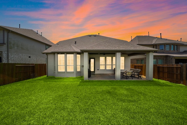 15610 Scolty Reach Ln, Humble, TX 77346 - rear view of property featuring a fenced backyard, a patio area, a shingled roof, and brick siding
