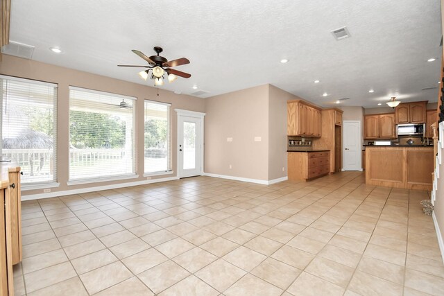 1019 N Country Club Dr, La Porte, TX 77571 - unfurnished living room featuring ceiling fan, light tile patterned flooring, and recessed lighting