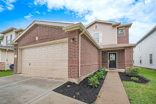 6723 Green Pear Ln, Houston, TX 77049 - view of front of home with brick siding, an attached garage, and driveway