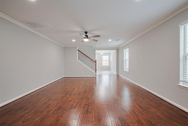 6723 Green Pear Ln, Houston, TX 77049 - unfurnished living room featuring a ceiling fan, dark wood-style flooring, stairs, and ornamental molding