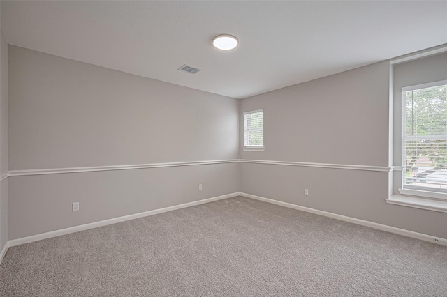 6723 Green Pear Ln, Houston, TX 77049 - empty room featuring healthy amount of natural light and carpet floors