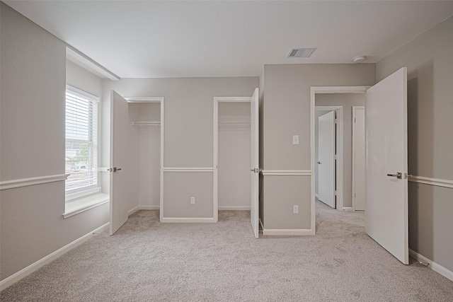 6723 Green Pear Ln, Houston, TX 77049 - unfurnished bedroom featuring carpet flooring and two closets