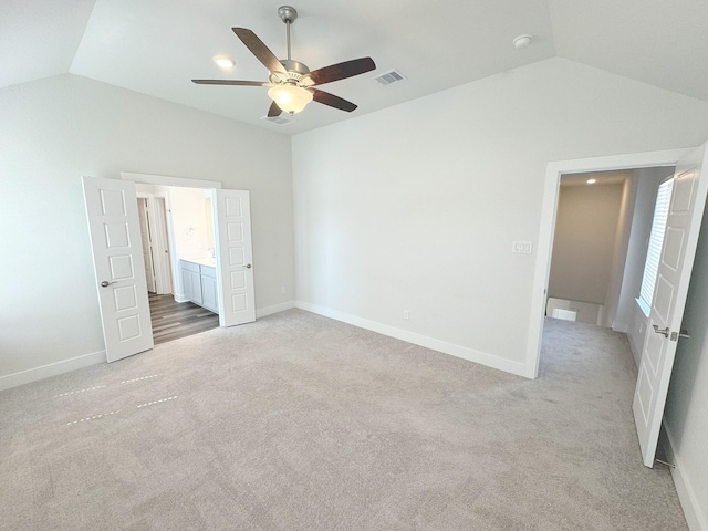 10654 Whitejacket, Conroe, TX 77385 - unfurnished bedroom with vaulted ceiling, light carpet, baseboards, and a ceiling fan