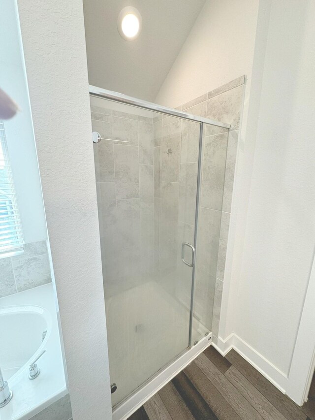 10654 Whitejacket, Conroe, TX 77385 - full bath with a shower stall, wood finished floors, and a garden tub