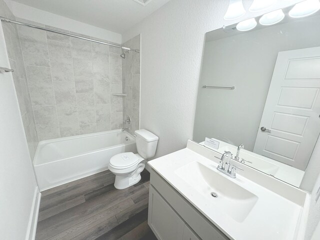 10654 Whitejacket, Conroe, TX 77385 - bathroom with wood finished floors, toilet, vanity, and  shower combination