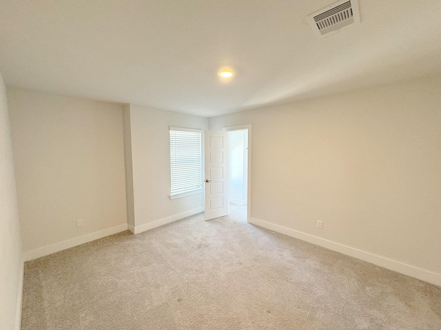 10654 Whitejacket, Conroe, TX 77385 - empty room featuring light carpet and baseboards