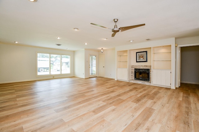 5651 Wigton Dr, Houston, TX 77096 - unfurnished living room with ceiling fan, baseboards, a brick fireplace, light wood finished floors, and recessed lighting