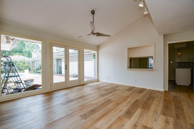 5651 Wigton Dr, Houston, TX 77096 - unfurnished living room featuring ceiling fan, light wood-style flooring, baseboards, track lighting, and high vaulted ceiling