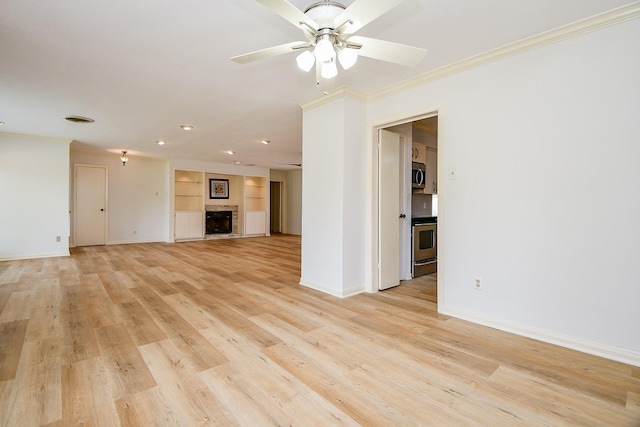 5651 Wigton Dr, Houston, TX 77096 - unfurnished living room featuring a ceiling fan, baseboards, recessed lighting, ornamental molding, and built in features