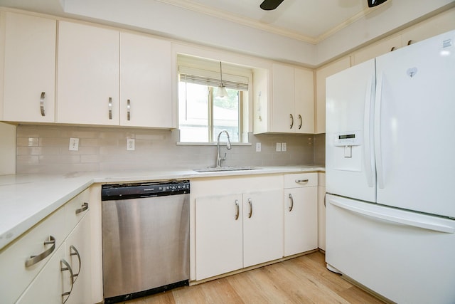 5651 Wigton Dr, Houston, TX 77096 - kitchen with white refrigerator with ice dispenser, stainless steel dishwasher, a sink, crown molding, and light countertops