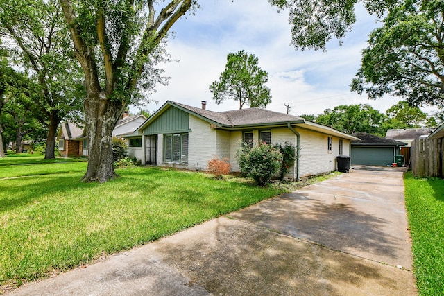 5651 Wigton Dr, Houston, TX 77096 - ranch-style house featuring brick siding, a front lawn, and a garage