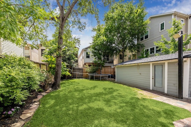 2408 Beall St, Houston, TX 77008 - view of yard featuring a trampoline and an outdoor structure