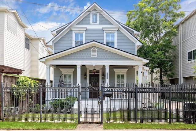 2408 Beall St, Houston, TX 77008 - view of front facade with a porch and a fenced front yard