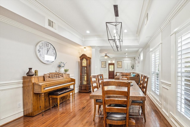 2408 Beall St, Houston, TX 77008 - dining area with hardwood / wood-style floors, a chandelier, a wainscoted wall, crown molding, and ceiling fan