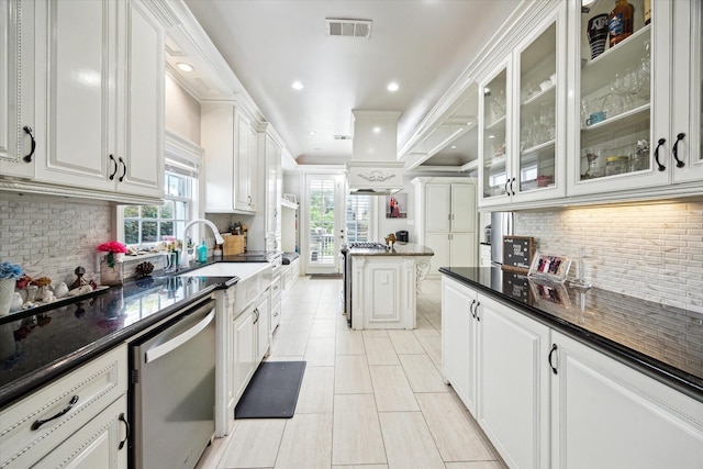 2408 Beall St, Houston, TX 77008 - kitchen with dishwasher, decorative backsplash, white cabinetry, glass insert cabinets, and recessed lighting