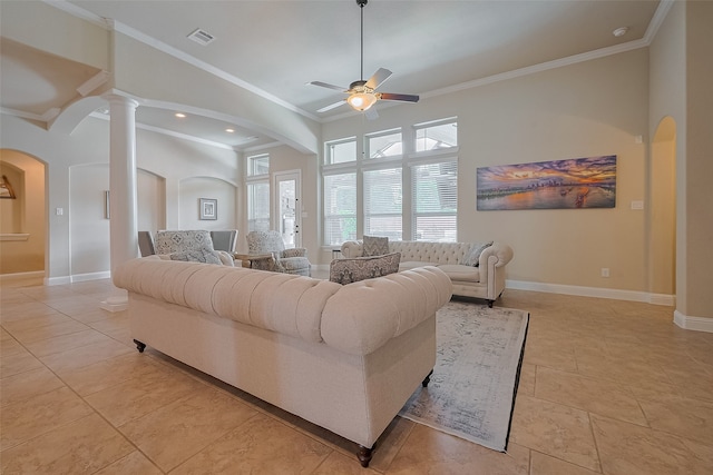 28210 Green Forest Bluff Trl, Katy, TX 77494 - living area featuring arched walkways, ceiling fan, decorative columns, ornamental molding, and light tile patterned floors