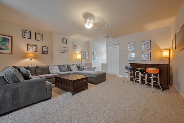 28210 Green Forest Bluff Trl, Katy, TX 77494 - living room featuring a ceiling fan, light colored carpet, and a dry bar