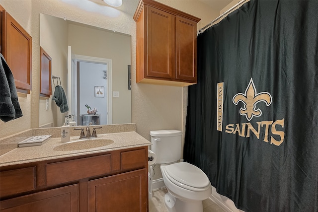 28210 Green Forest Bluff Trl, Katy, TX 77494 - bathroom with vanity, a textured wall, and a shower with curtain