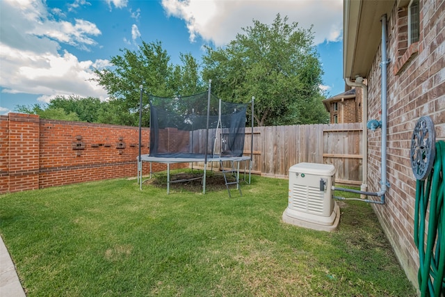 28210 Green Forest Bluff Trl, Katy, TX 77494 - fenced backyard featuring a trampoline