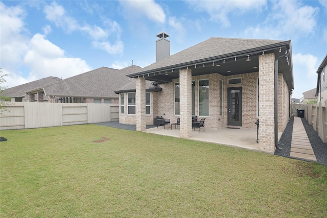 5122 Walnut Grove Ln, Manvel, TX 77578 - back of house featuring brick siding, a chimney, roof with shingles, and a patio area