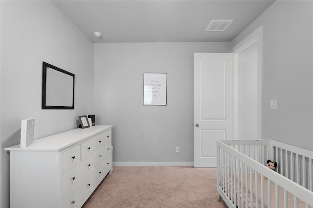 5122 Walnut Grove Ln, Manvel, TX 77578 - bedroom featuring light colored carpet, baseboards, and a crib