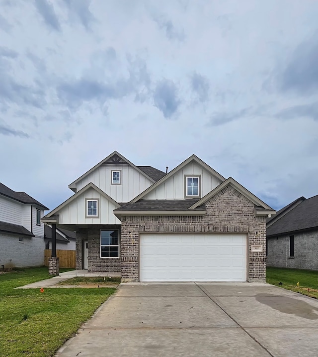 134 Peachleaf Ct, Anahuac, TX 77514 - view of front facade featuring board and batten siding, brick siding, and driveway