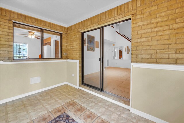 6803 Lakemont Dr, Houston, TX 77050 - empty room featuring baseboards, a ceiling fan, and crown molding