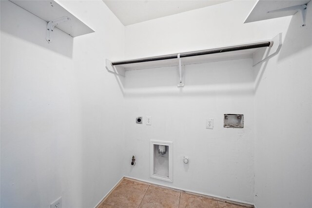 13814 Fort Nelson Dr, Houston, TX 77083 - laundry room with hookup for a gas dryer, hookup for an electric dryer, washer hookup, and light tile patterned flooring