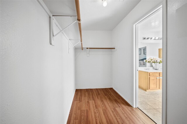 13814 Fort Nelson Dr, Houston, TX 77083 - spacious closet with wood finished floors