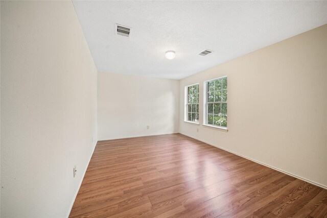 13814 Fort Nelson Dr, Houston, TX 77083 - empty room with light wood finished floors