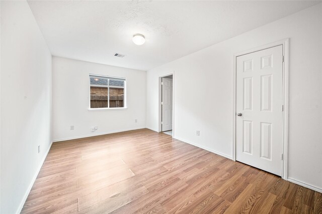 13814 Fort Nelson Dr, Houston, TX 77083 - unfurnished bedroom featuring light wood-style floors and baseboards