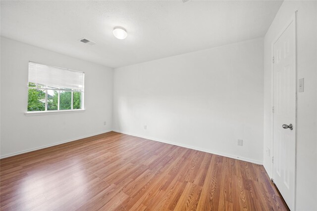 13814 Fort Nelson Dr, Houston, TX 77083 - spare room with light wood-style flooring and baseboards