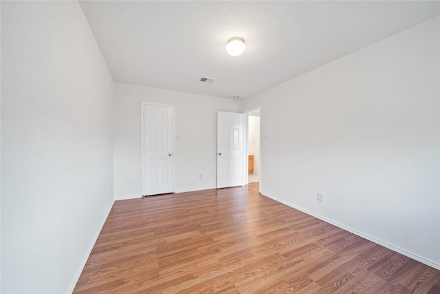 13814 Fort Nelson Dr, Houston, TX 77083 - unfurnished bedroom with light wood-style floors and baseboards