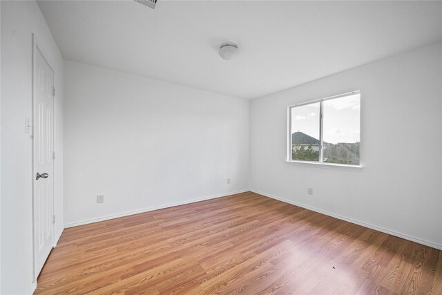 13814 Fort Nelson Dr, Houston, TX 77083 - unfurnished bedroom featuring light wood-style floors and baseboards