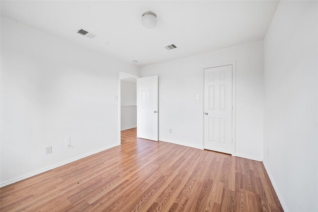 13814 Fort Nelson Dr, Houston, TX 77083 - unfurnished bedroom featuring light wood-type flooring and baseboards