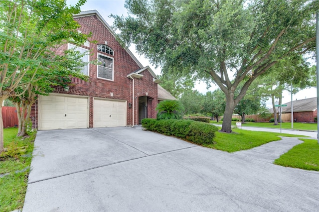 8034 High Hollow Ln, Houston, TX 77070 - view of front of property featuring brick siding, concrete driveway, and a garage