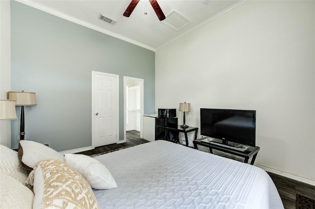 8034 High Hollow Ln, Houston, TX 77070 - bedroom with dark wood-style flooring, crown molding, a ceiling fan, and attic access