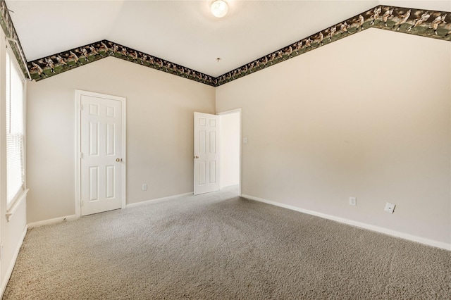8034 High Hollow Ln, Houston, TX 77070 - carpeted empty room featuring vaulted ceiling and baseboards