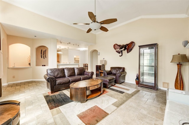 8034 High Hollow Ln, Houston, TX 77070 - living area with ceiling fan, arched walkways, light stone finish flooring, vaulted ceiling, and crown molding