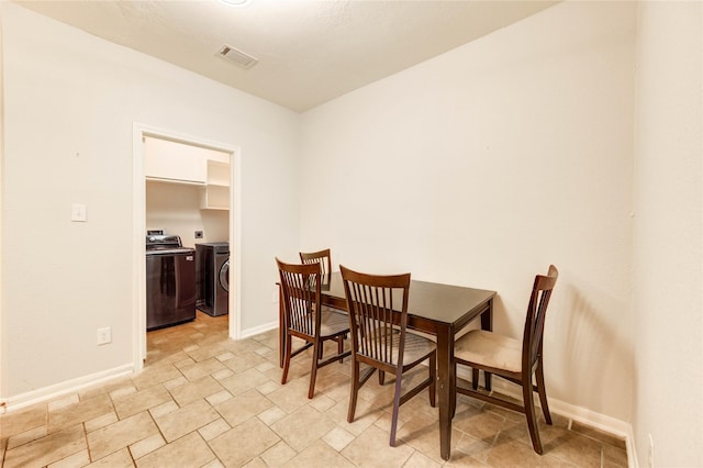 8034 High Hollow Ln, Houston, TX 77070 - dining area featuring washer and dryer and stone finish flooring