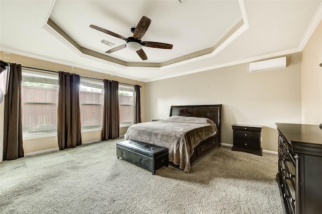 8034 High Hollow Ln, Houston, TX 77070 - carpeted bedroom with a tray ceiling, a wall mounted AC, crown molding, and a ceiling fan