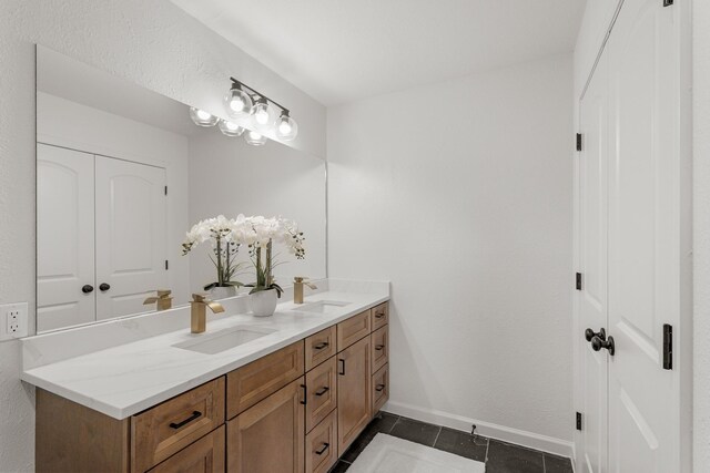 5302 Wigton Dr, Houston, TX 77096 - full bath with double vanity and tile patterned floors