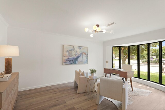 5302 Wigton Dr, Houston, TX 77096 - dining room with plenty of natural light, light wood finished floors, a chandelier, ornamental molding, and an office area