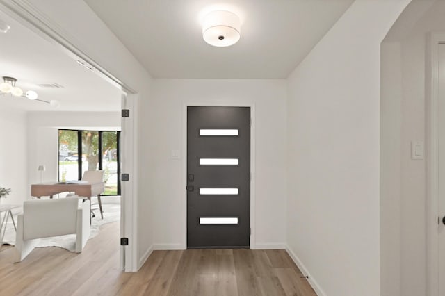 5302 Wigton Dr, Houston, TX 77096 - foyer featuring light wood-style floors and baseboards