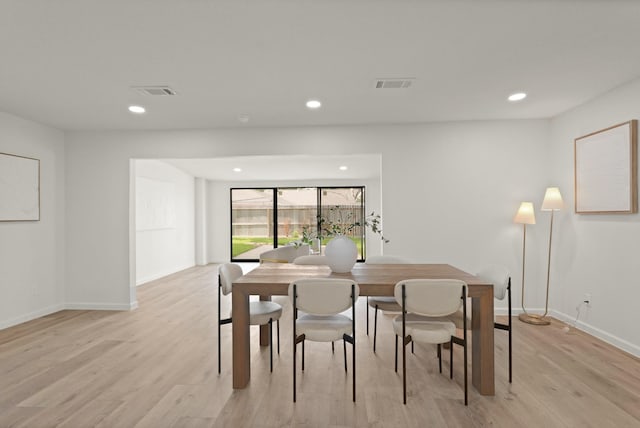 5302 Wigton Dr, Houston, TX 77096 - dining area with light wood finished floors and recessed lighting